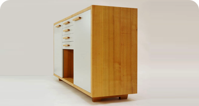 Custom wooden cabinet with white drawers and doors on a light background.